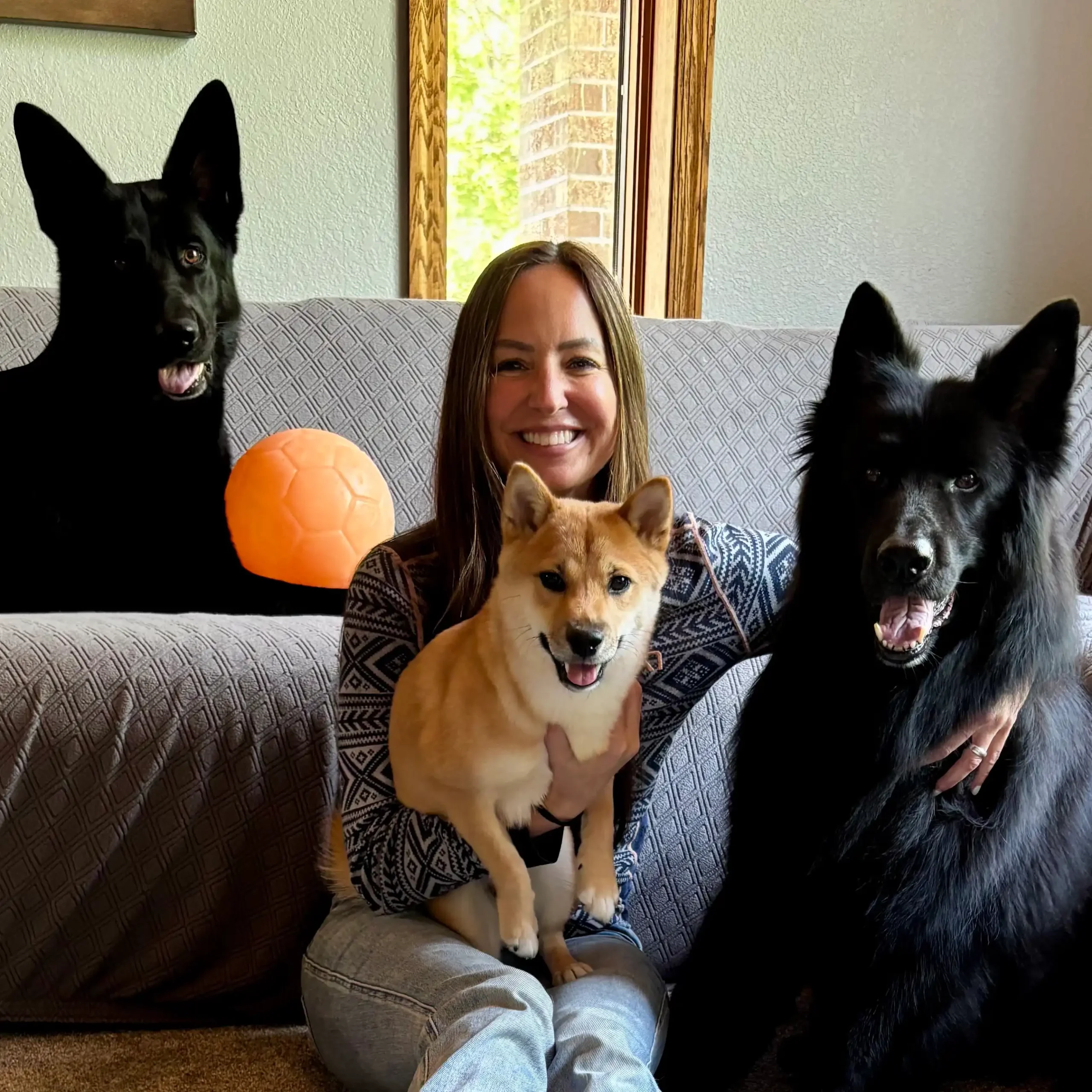 About_Dana_Peters_Danas_Wellness_About_Us_Naples_Florida Image of Dana Peters with her three fury dogs